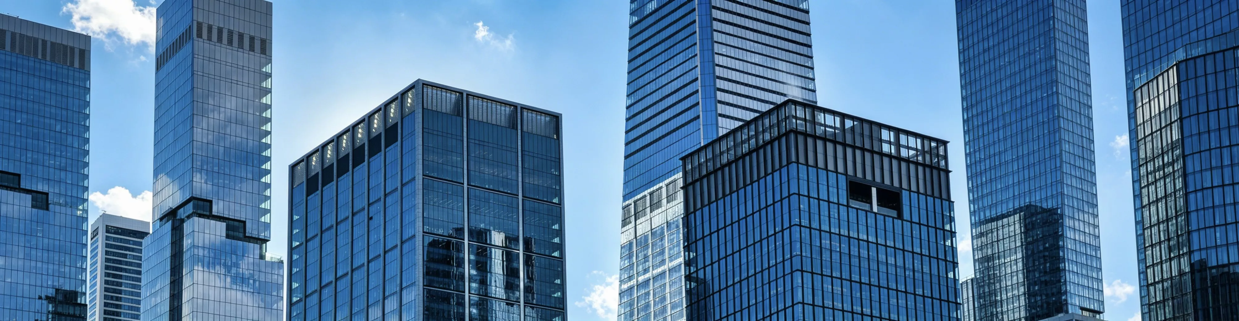 Modern office buildings under a blue sky